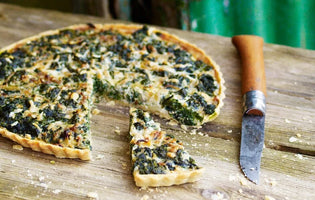 Nettle and Garlic Tart on Wooden Board