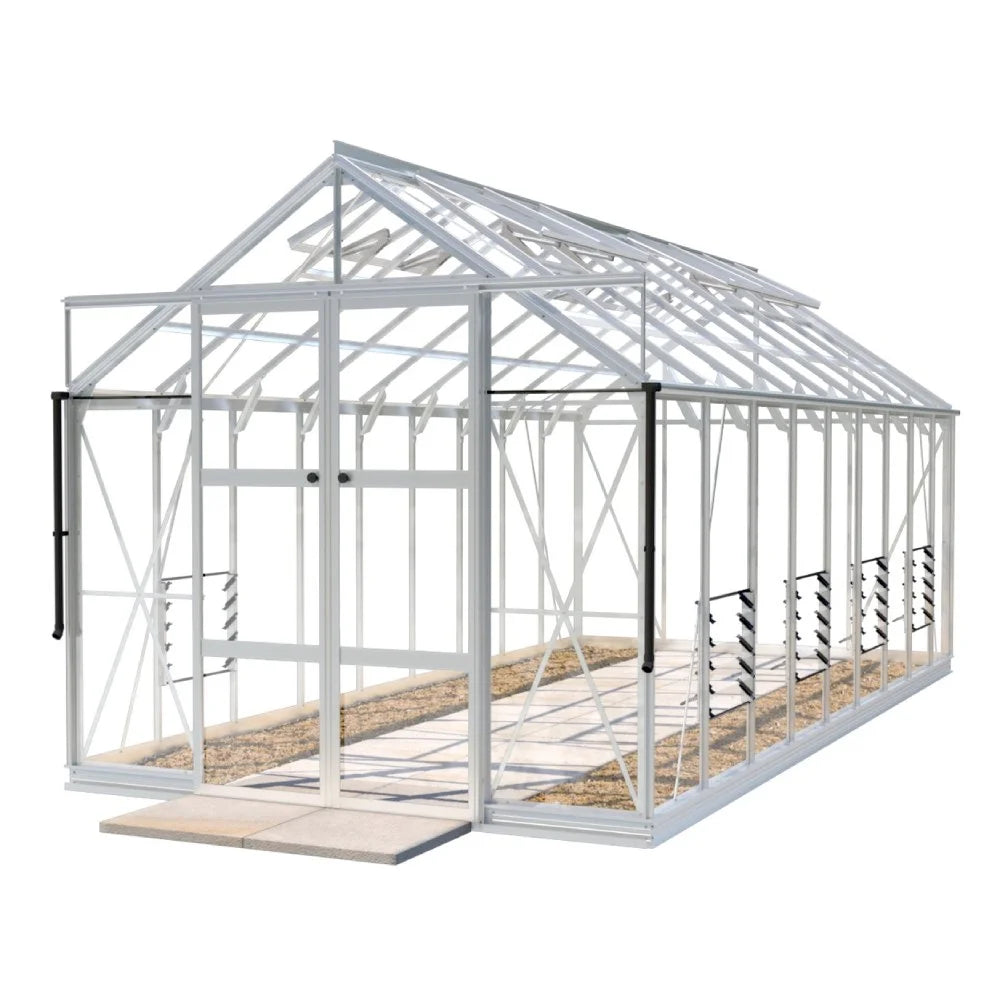 A large, white-framed Rhino Greenhouse with transparent panels stands on a concrete base. It features sliding doors and interior staging shelves, set in a minimalistic outdoor environment.
