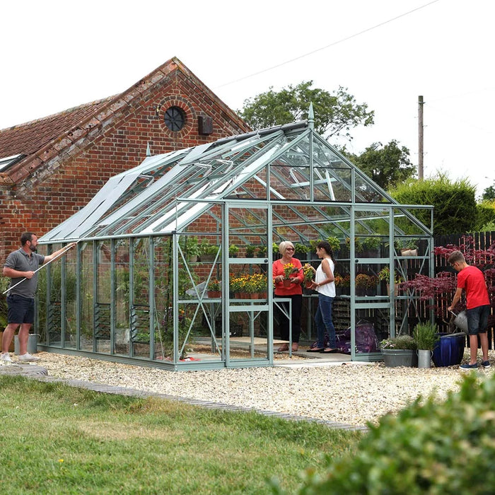 Family surrounding their Rhino Greenhouse in their garden