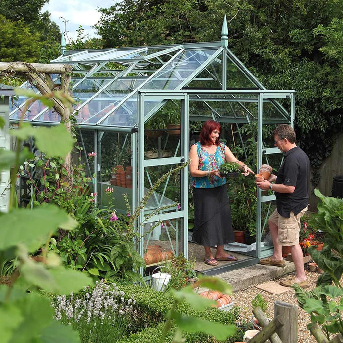 Man and woman gardening in besides their Rhino Premium